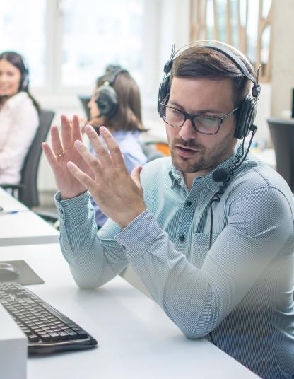 Lutron 24/7 customer support specialist providing technical guidance via headset