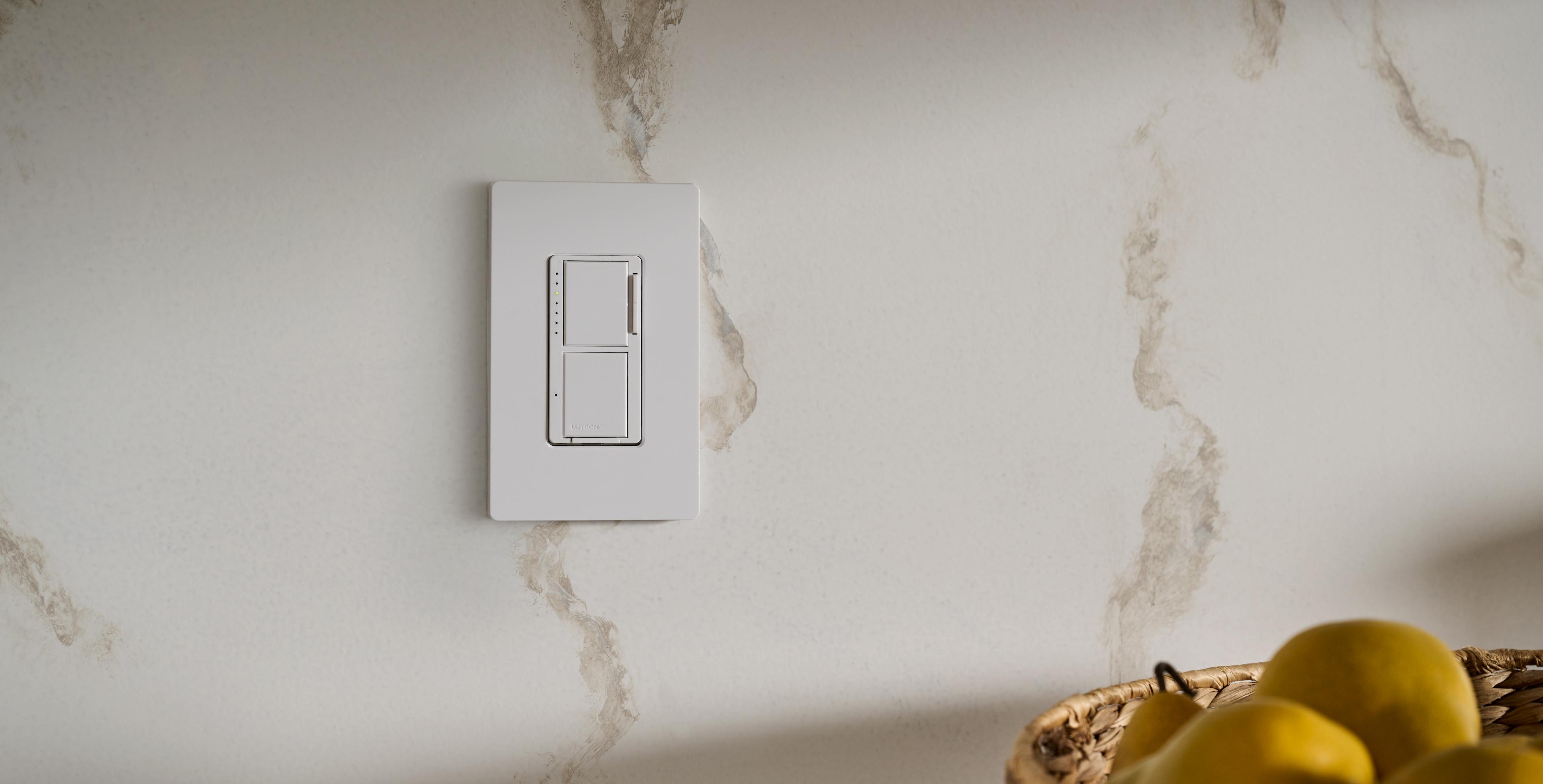 A close up of a dimmer switch in a kitchen.